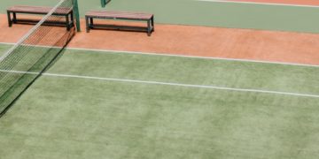 empty green and orange tennis fields