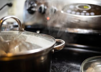 stainless steel cooking pot on black table