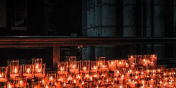 lighted candles on brown wooden table