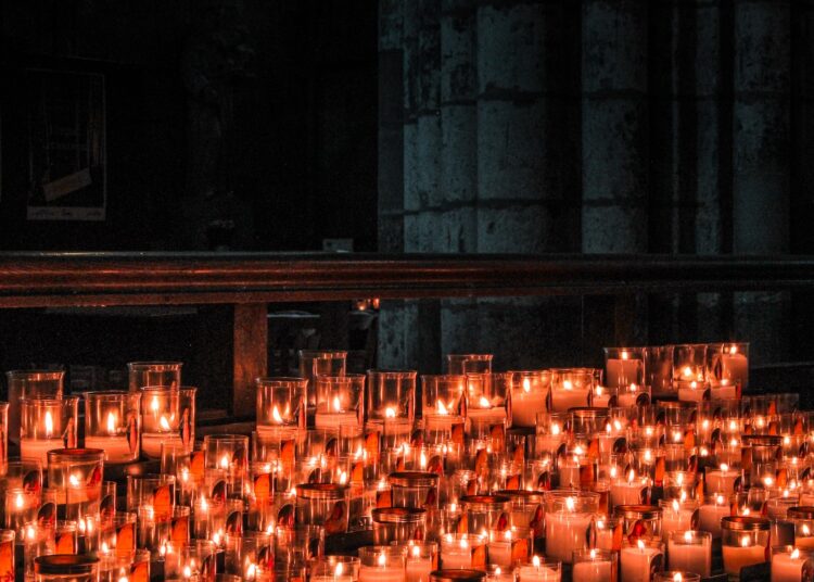 lighted candles on brown wooden table